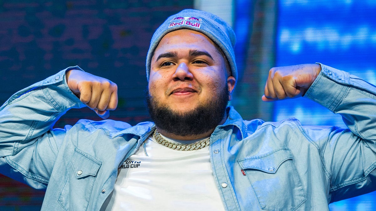 MenaRD smiles and flexes his biceps at Evo 2025.